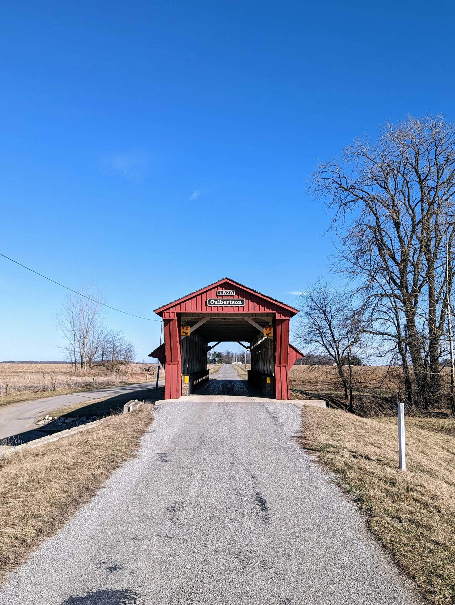 A red covered bridge on the road leading to the Adams Brothers farm