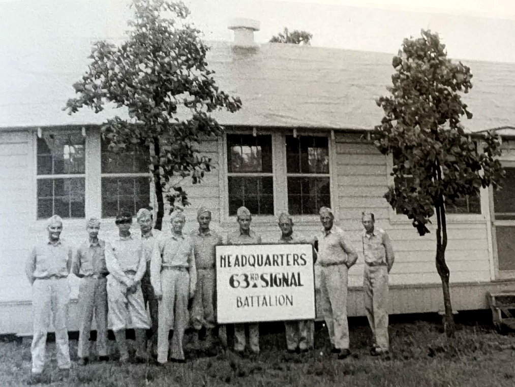 Officers of the 63rd Signal Battalion outside battalion headquarters