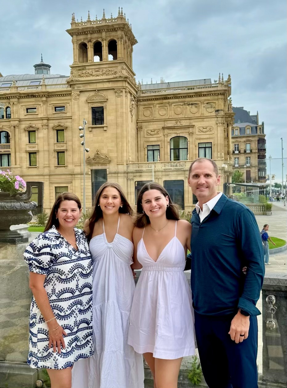The Wieringa family standing together in front of an ornate historic building